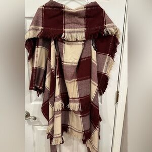 Maroon and white plaid shawl.
